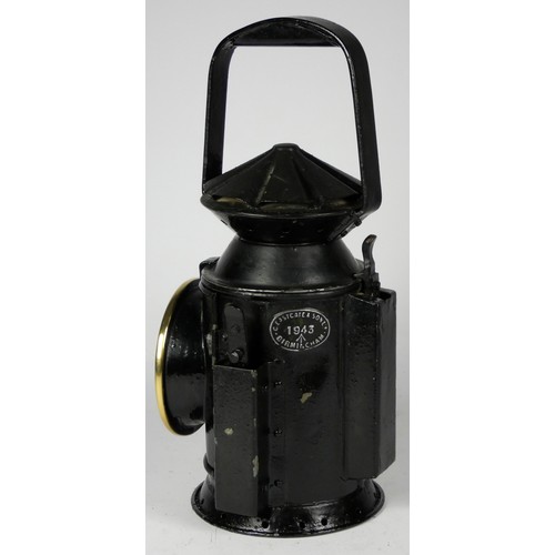 69 - A black War Dept 3 aspect handlamp, marked with W.D. broad arrow 1943), complete with burned