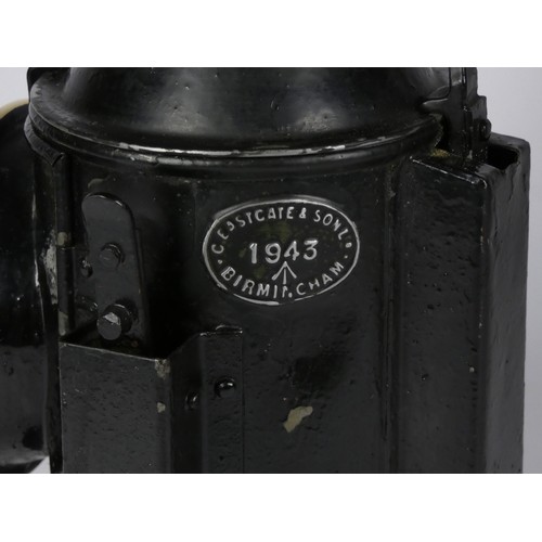 69 - A black War Dept 3 aspect handlamp, marked with W.D. broad arrow 1943), complete with burned