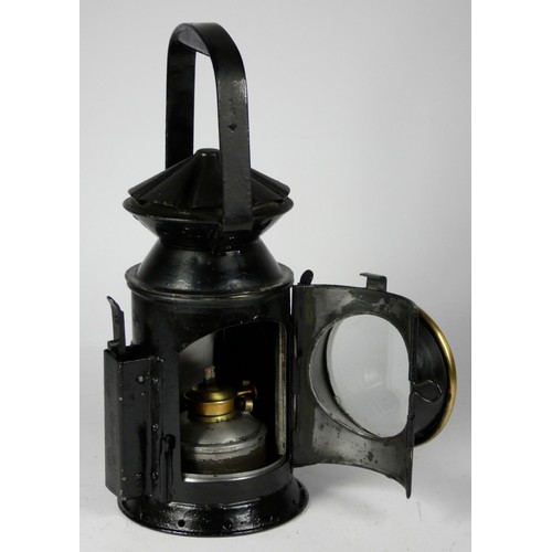 69 - A black War Dept 3 aspect handlamp, marked with W.D. broad arrow 1943), complete with burned