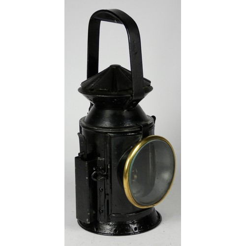 69 - A black War Dept 3 aspect handlamp, marked with W.D. broad arrow 1943), complete with burned