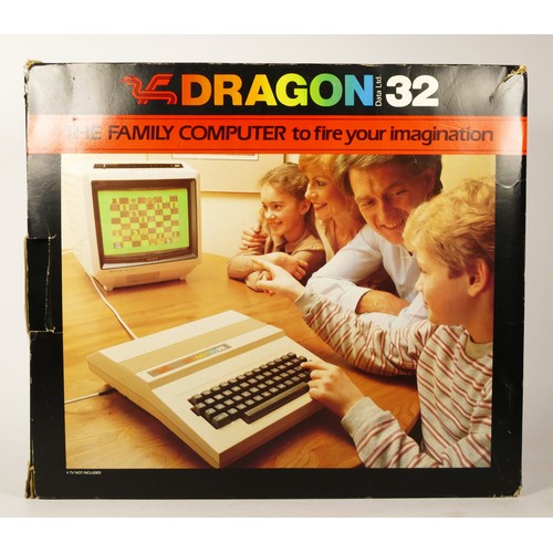 97 - A Dragon 32 home computer, by Data Ltd (serial No. 123312), power and AV cables, An Introduction To ... 