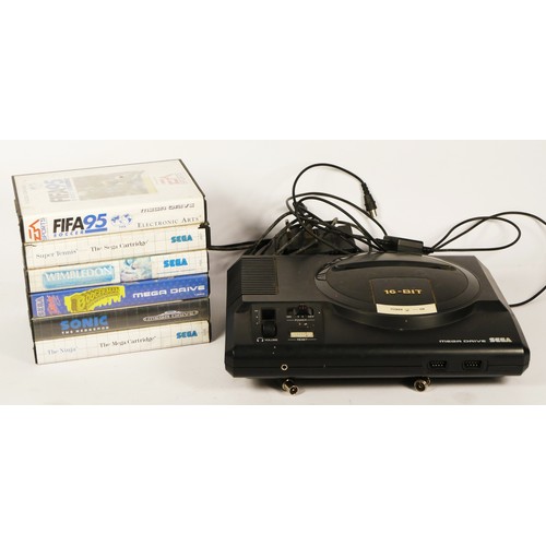 98 - A Sega Mega Drive, (serial No. 120638467), with power and AV cable, together with six games, boxed, ... 