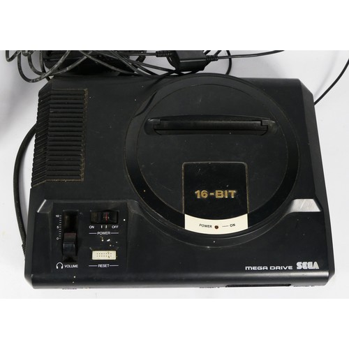 98 - A Sega Mega Drive, (serial No. 120638467), with power and AV cable, together with six games, boxed, ... 