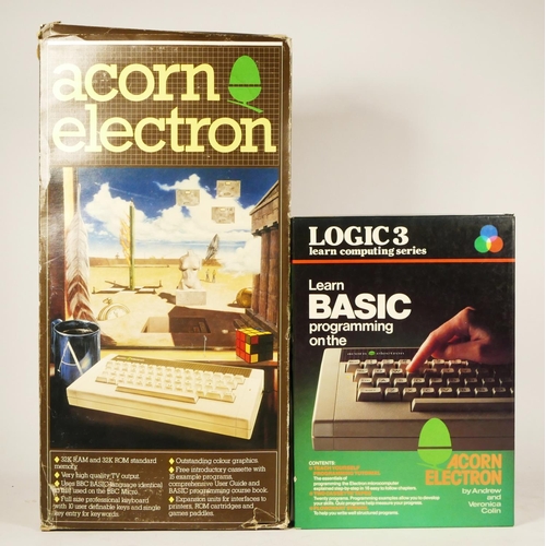 104 - An Acorn Electron computer (serial No 07-ALA01-0145463), with AV and power cables, user guide and St... 