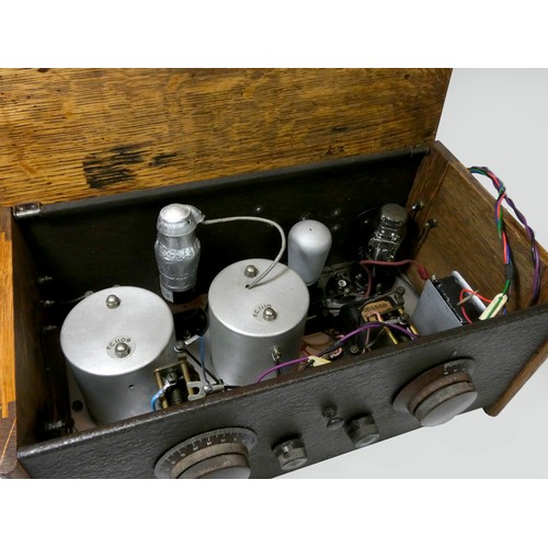 134 - A Cossor 234 valve radio, c.1929, 43cm x 20cm x 24cm, together with a later power pack and speaker