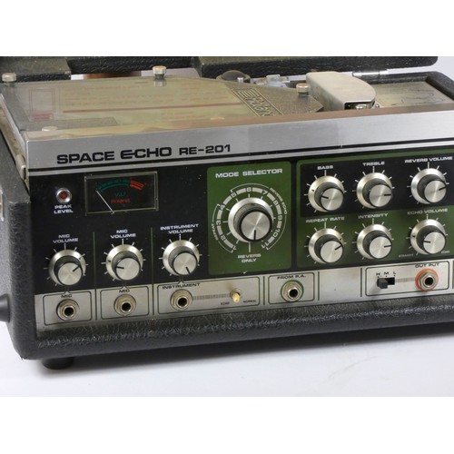 174 - A Roland Space Echo RE-201, effects unit, with four spare tapes