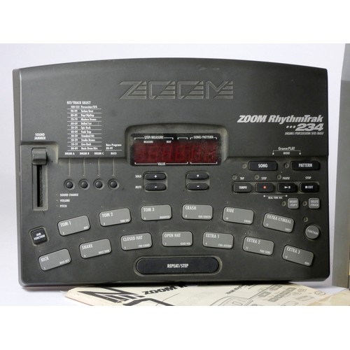 178 - An Alesis HR-16 high Sample Rate drum machine, with manual, together with a Zoom RhythmTraK 234 drum... 