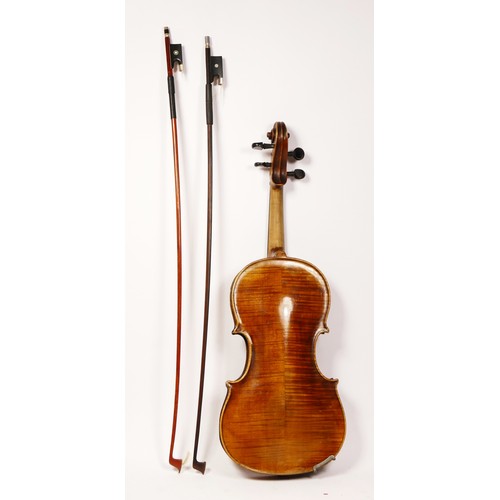 197 - A unbranded violin, with two piece back, with two later bows, one signed Czecholovakia, in a leather... 