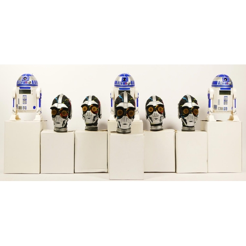 255 - Three R2-D2 alarm clocks, boxed with instructions, together with five C3PO electronic heads, boxed, ... 