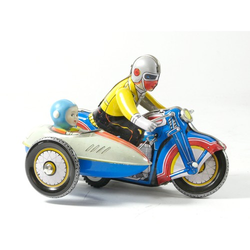 310 - A tinplate clockwork motorcycle with sidecar, made in China, original box, 18cm