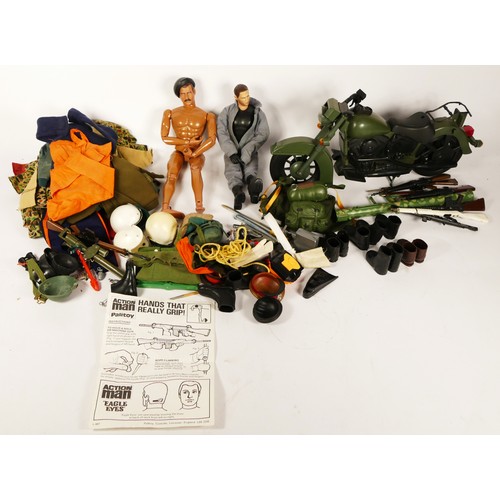 311 - An extensive collection of Action Man accessories, including rifles, hand guns, grenades, boots, clo... 