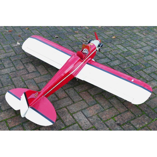 314 - A remote control model plane, Irvine engine with Futaba S3003 servos, red and white livery, 150cm wi... 