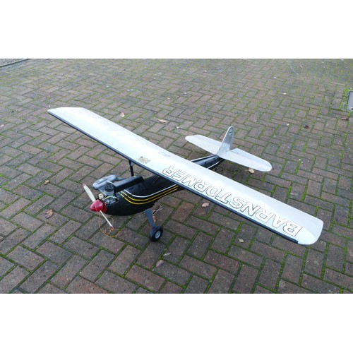 318 - A remote control model plane, unknown engine, black, gold and white livery, silver livery wings with... 