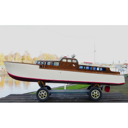 323 - A remote controlled cruiser boat, complete with propellers and servos, white and red livery, Merlin ... 