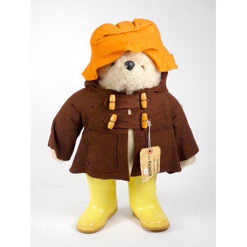 328 - A Paddington bear teddy, c.1972, made by Gabrielle, in felt orange rain cap, felt duffle coat with w... 