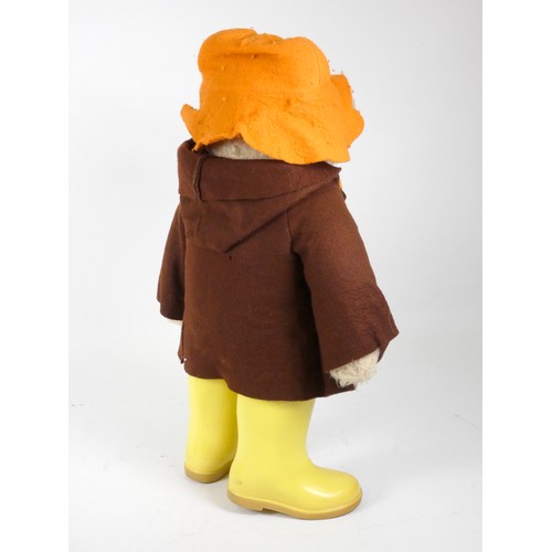 328 - A Paddington bear teddy, c.1972, made by Gabrielle, in felt orange rain cap, felt duffle coat with w... 