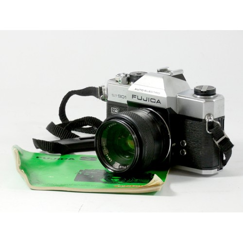 352 - A Fujica ST901 35mm film camera, together with a Fujinon 55mm f1.8 lens, with lens capp, strap and m... 