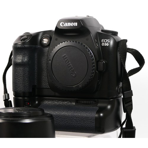 354 - A Canon D30 DSLR camera, together with a a Sigma 28mm-135mm f3.8-f5.6 lens, a Sigma 70mm-300mm f4-f5... 