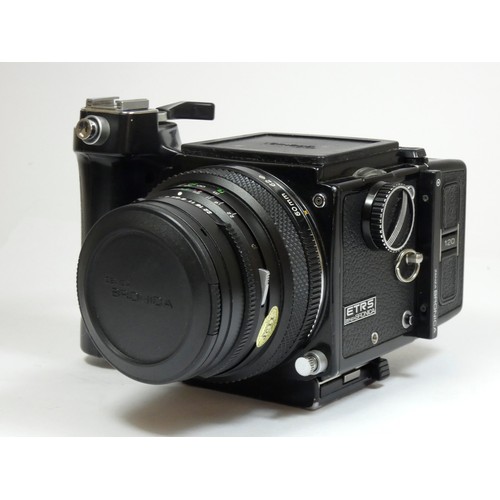 355 - A Bronica ETRS medium format camera, with 50mm f2.8 lens, manual grip and 120 film back, with manual