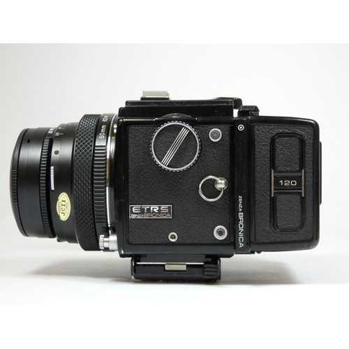 355 - A Bronica ETRS medium format camera, with 50mm f2.8 lens, manual grip and 120 film back, with manual