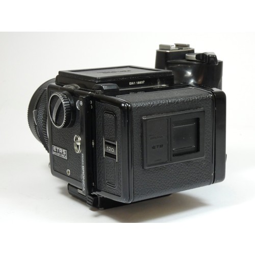 355 - A Bronica ETRS medium format camera, with 50mm f2.8 lens, manual grip and 120 film back, with manual