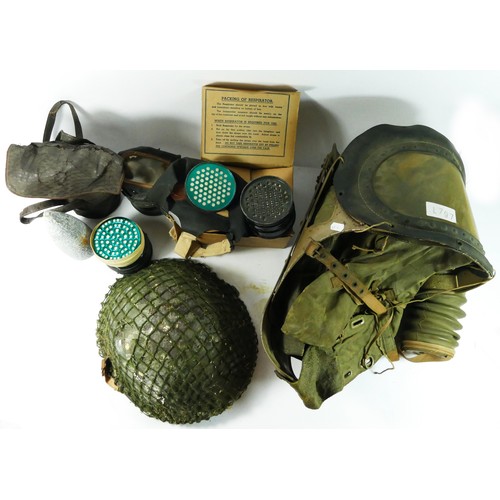 394 - WWII a PSC 1939 baby's gas mask, a gas mask in cardboard box , two other respirators (A/F), a shell ... 