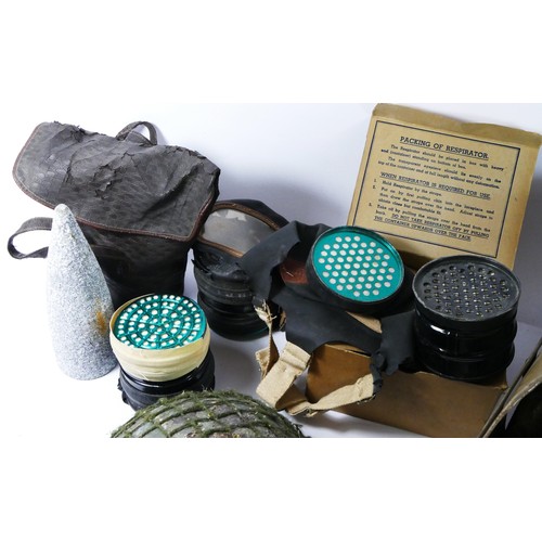 394 - WWII a PSC 1939 baby's gas mask, a gas mask in cardboard box , two other respirators (A/F), a shell ... 