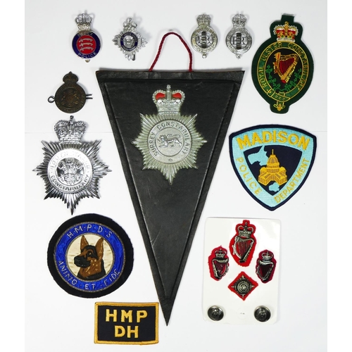 401 - A collection of police and prison officers badges, including Royal Ulster and South Wales