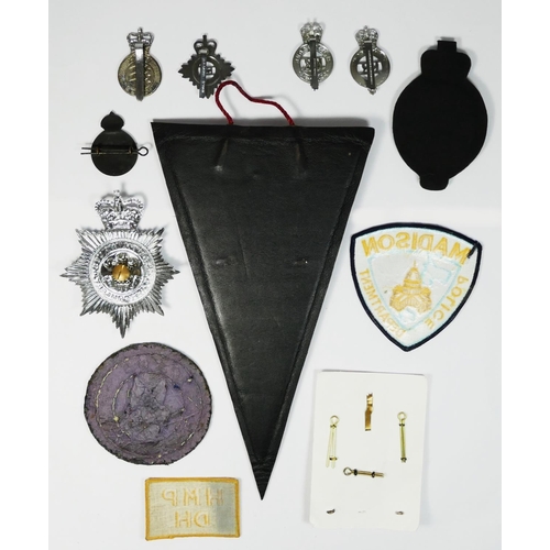 401 - A collection of police and prison officers badges, including Royal Ulster and South Wales