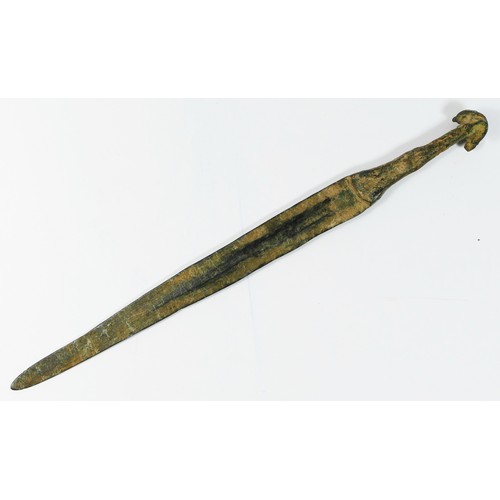 414 - A Luristan bronze dagger, with ribbed blade and ear pommel, 28.5cm.
Provenance; purchased by the ven... 