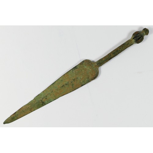 415 - A Luristan bronze dagger, with plain blade and basket pommel, 24cm.
Provenance; purchased by the ven... 