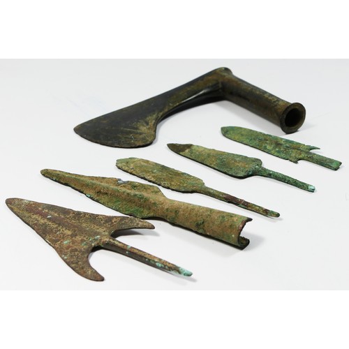 416 - Five Luristan bronze arrow/spear heads, together with a bronze axe head, 15 x 10.5cm.
Provenance; pu... 