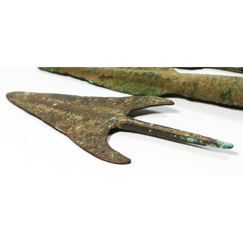 416 - Five Luristan bronze arrow/spear heads, together with a bronze axe head, 15 x 10.5cm.
Provenance; pu... 