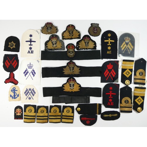 424 - A collection of Naval fabric badges, officers and other ranks