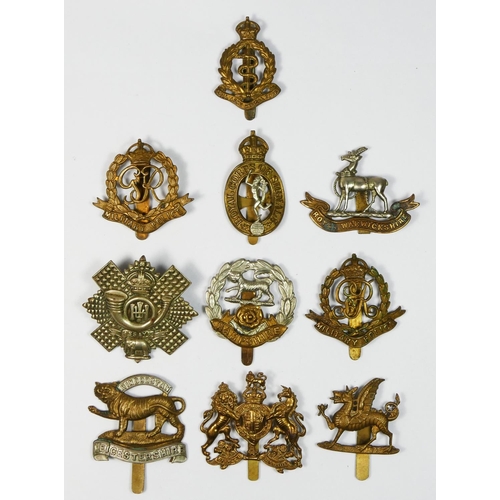 429 - Ten military cap badges, to include Military Police and Hampshire regiment