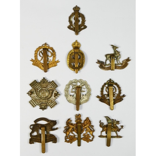 429 - Ten military cap badges, to include Military Police and Hampshire regiment