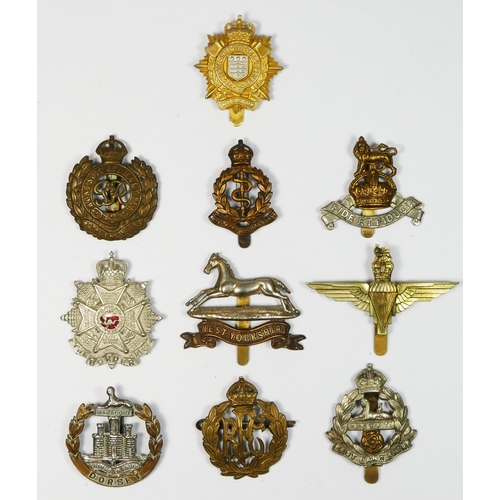 430 - Ten Military cap badges, to include Border Regiment and Parachute Regiment