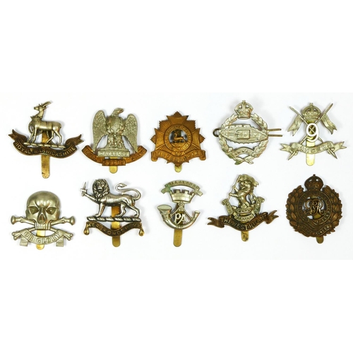 432 - Ten military cap badges, including the Tank Regiment and West Riding.