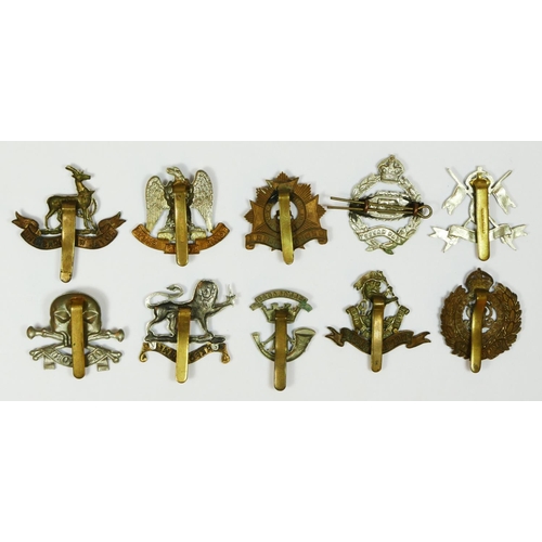 432 - Ten military cap badges, including the Tank Regiment and West Riding.