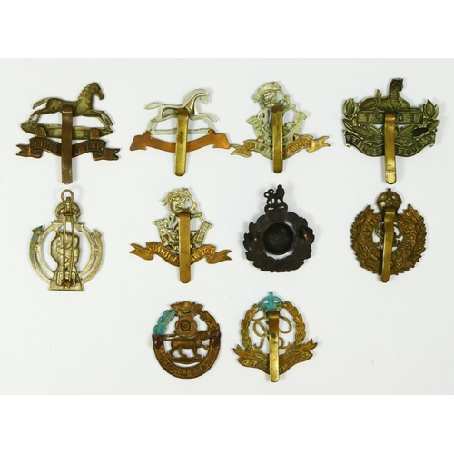 433 - Ten military cap badges, including the, Royal Armoured Corps, 3rd The Kings Own Hussars, and Royal M... 