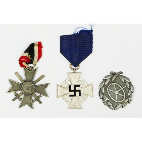 434 - A WWII German drivers badge, a Merit Cross with Swords and a Long Service Medal (3).