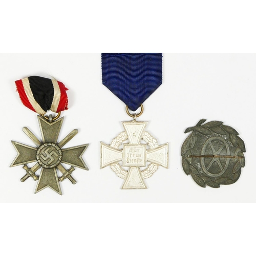 434 - A WWII German drivers badge, a Merit Cross with Swords and a Long Service Medal (3).