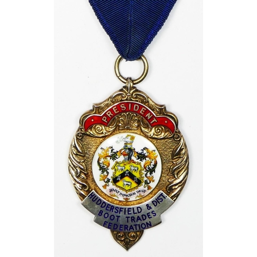 447 - Of Huddersfield and District Boot Trade Federation interest, a silver and enamel Presidents medal, s... 