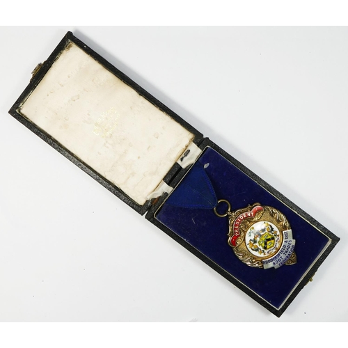 447 - Of Huddersfield and District Boot Trade Federation interest, a silver and enamel Presidents medal, s... 