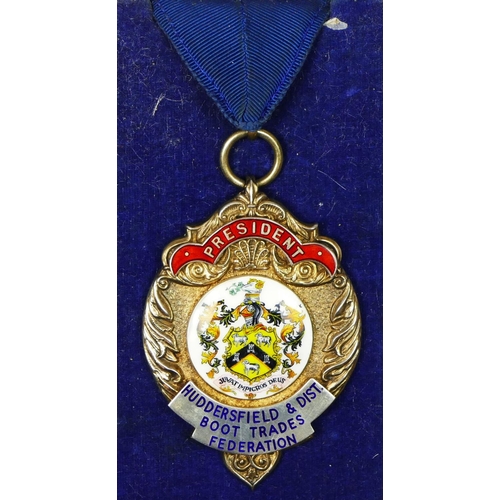 447 - Of Huddersfield and District Boot Trade Federation interest, a silver and enamel Presidents medal, s... 