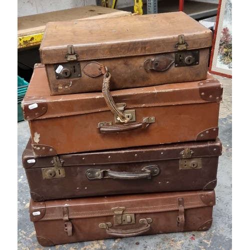 260 - A brown leather vintage suitcase initialled J.S. 50 x 33 x 15cm, together with three other vintage s... 