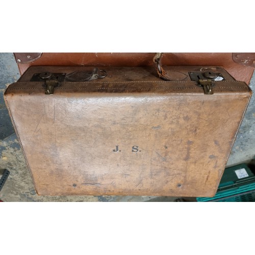 260 - A brown leather vintage suitcase initialled J.S. 50 x 33 x 15cm, together with three other vintage s... 