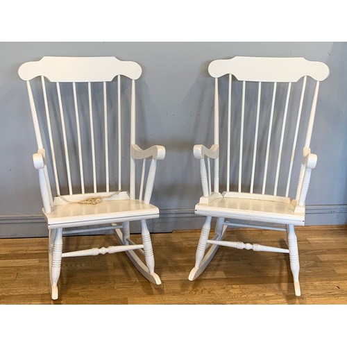 275 - A pair of painted pine high backed rocking chairs, with turned wood detail.
50cm x 105cm x 73cm (2)