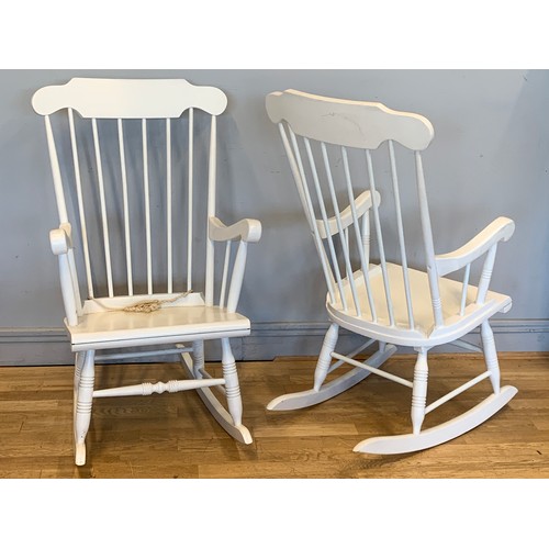 275 - A pair of painted pine high backed rocking chairs, with turned wood detail.
50cm x 105cm x 73cm (2)