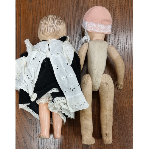 271 - A fabric head cloth doll and a Papier Mache doll (2)